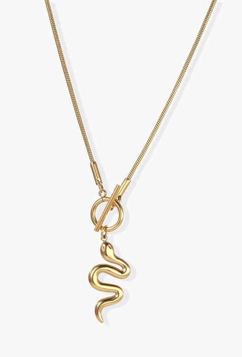 Sculptural gold snake pendant on delicate chain with toggle clasp, featuring smooth curves and polished 14K gold plated finish