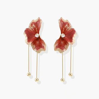 Red enamel flower earrings with gold-plated stems, central pearl, and gradient coral-to-gold petals on white background