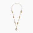14K gold plated necklace with organic leaf motifs and freshwater pearls arranged in an elegant chain design on neutral background.