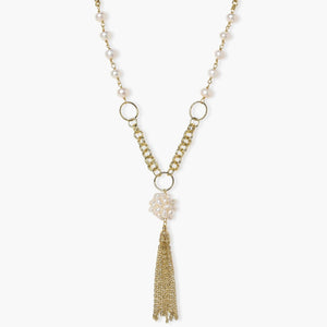 Long gold-plated necklace with freshwater pearls, chunky chain links, and flowing tassel pendant