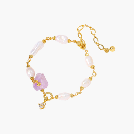 Gold-plated bracelet with lustrous baroque pearls and raw lavender amethyst centerpiece on white background.