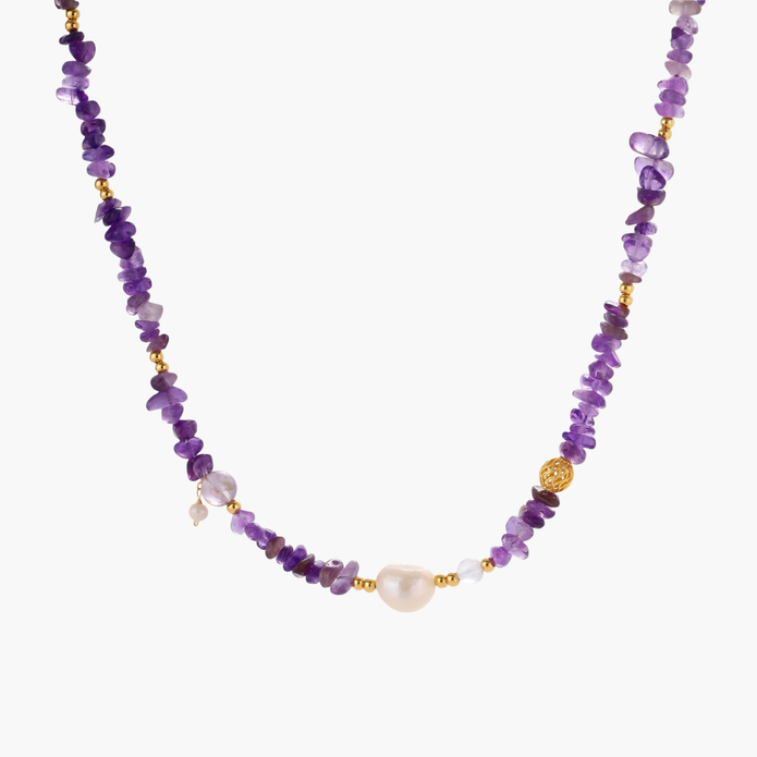 Beaded necklace with purple amethyst chips, freshwater pearls, and gold accents on white background.
