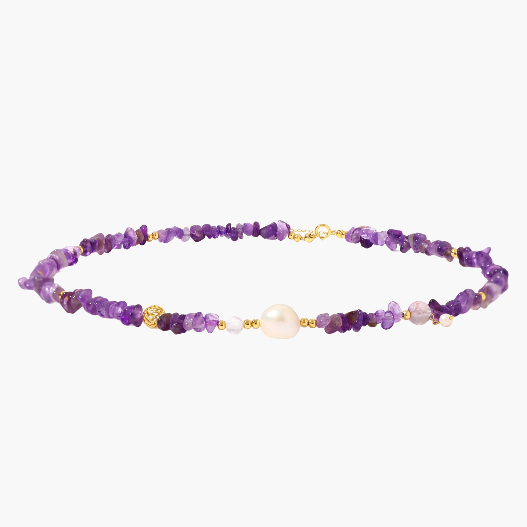Beaded necklace with purple amethyst chips, freshwater pearls, and gold accents on white background.