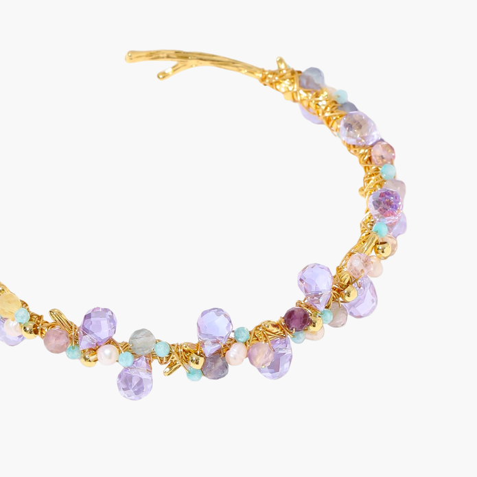Gold-plated adjustable cuff bracelet with clustered lavender fluorite, turquoise beads, and freshwater pearls on white background.