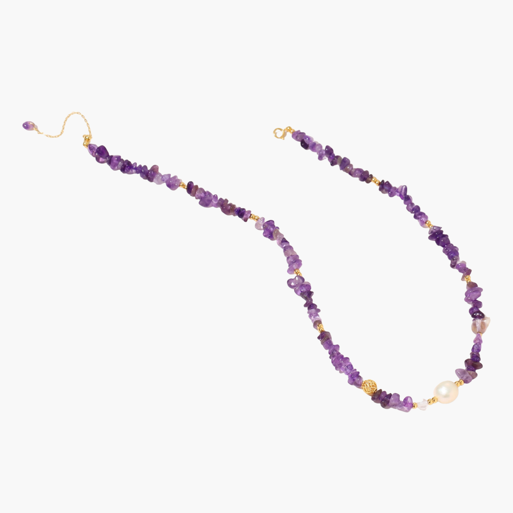 Beaded necklace with purple amethyst chips, freshwater pearls, and gold accents on white background.