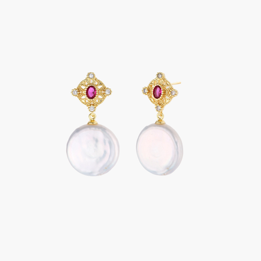 Gold baroque pearl earrings with pink gemstone studs and ornate detailing on cream background.