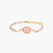 Delicate beaded bracelet with pastel rose quartz, pearls, and pink cushion-cut centerpiece in gold-plated setting