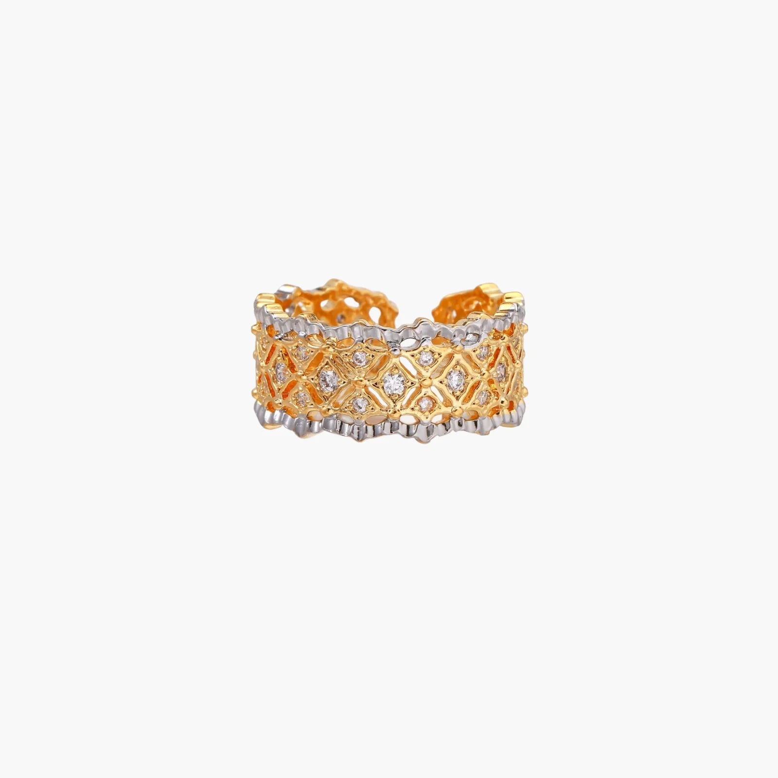 Two-tone ring with geometric lattice pattern in gold and silver finish with crystal accents on beige background