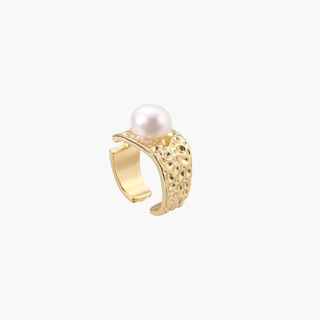 Wide gold-plated ring with organic textured band and white freshwater pearl centerpiece