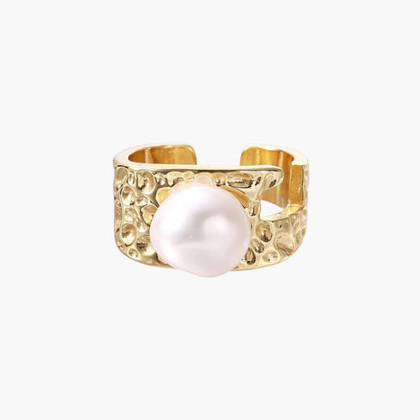 Wide gold-plated ring with organic textured band and white freshwater pearl centerpiece