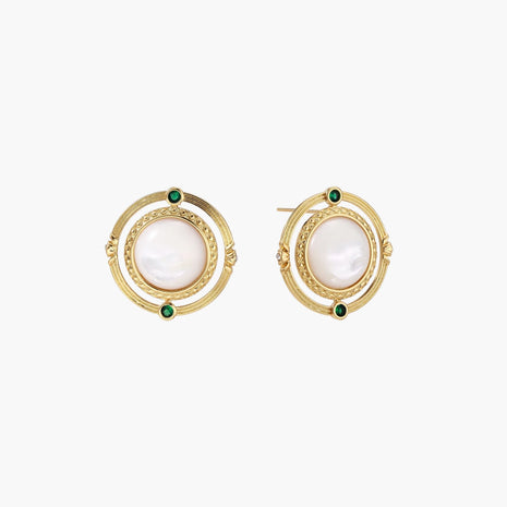 Circular gold stud earrings with iridescent mother-of-pearl center and green zirconia accents on cream background.