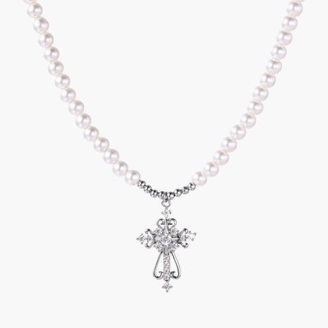 White pearl beaded necklace with ornate crystal-embellished cross pendant on white background, white gold plated finish