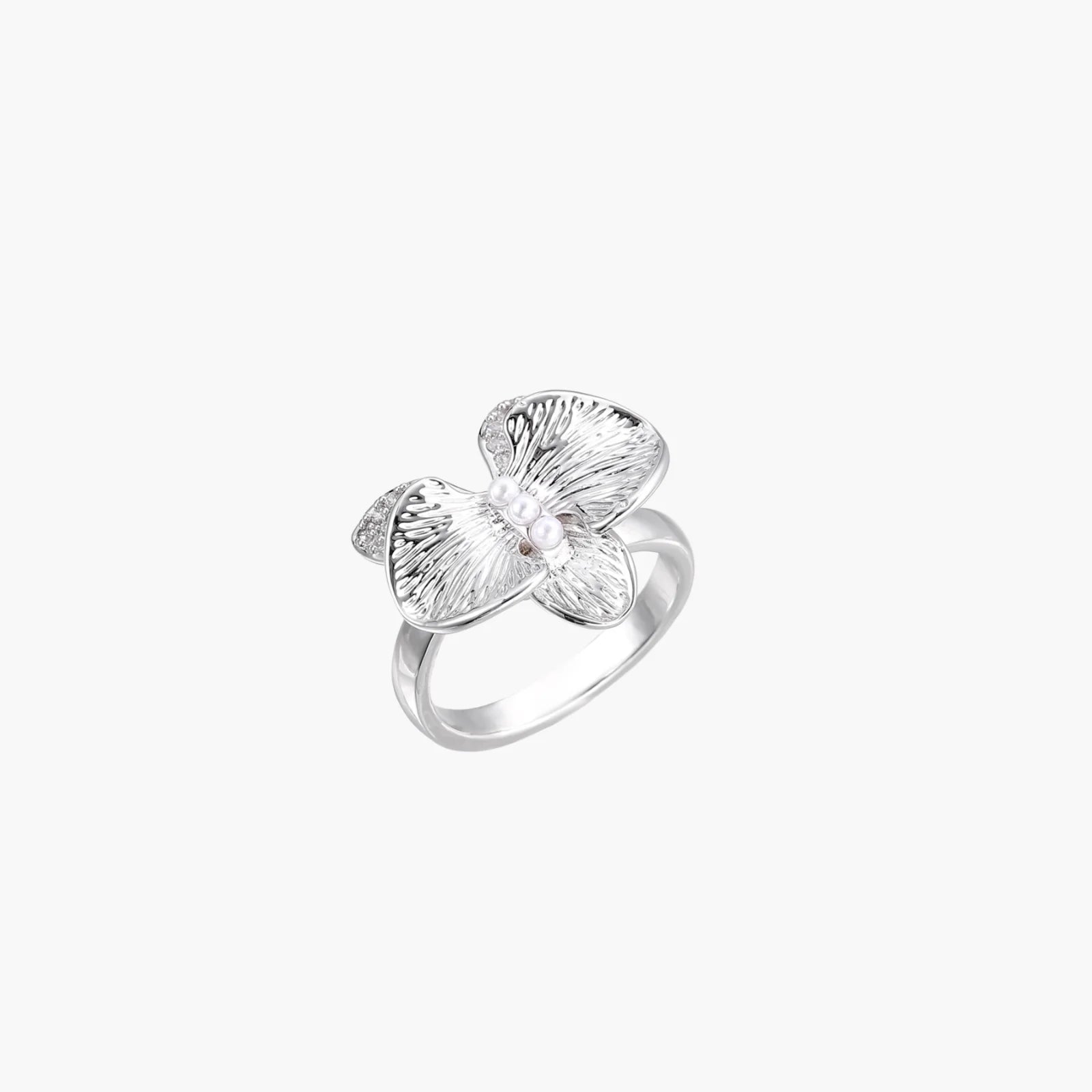 Silver-toned orchid ring with textured petals, pearl center accents, and sparkling zirconia stones on white background.