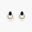 Gold drop earrings with oval lapis lazuli, crystal-paved frame, and iridescent mother-of-pearl teardrop on cream background