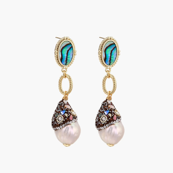 Gold drop earrings with iridescent abalone studs, rope links, jeweled caps and white baroque pearls on cream background
