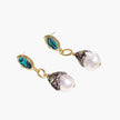 Gold drop earrings with iridescent abalone studs, rope links, jeweled caps and white baroque pearls on cream background