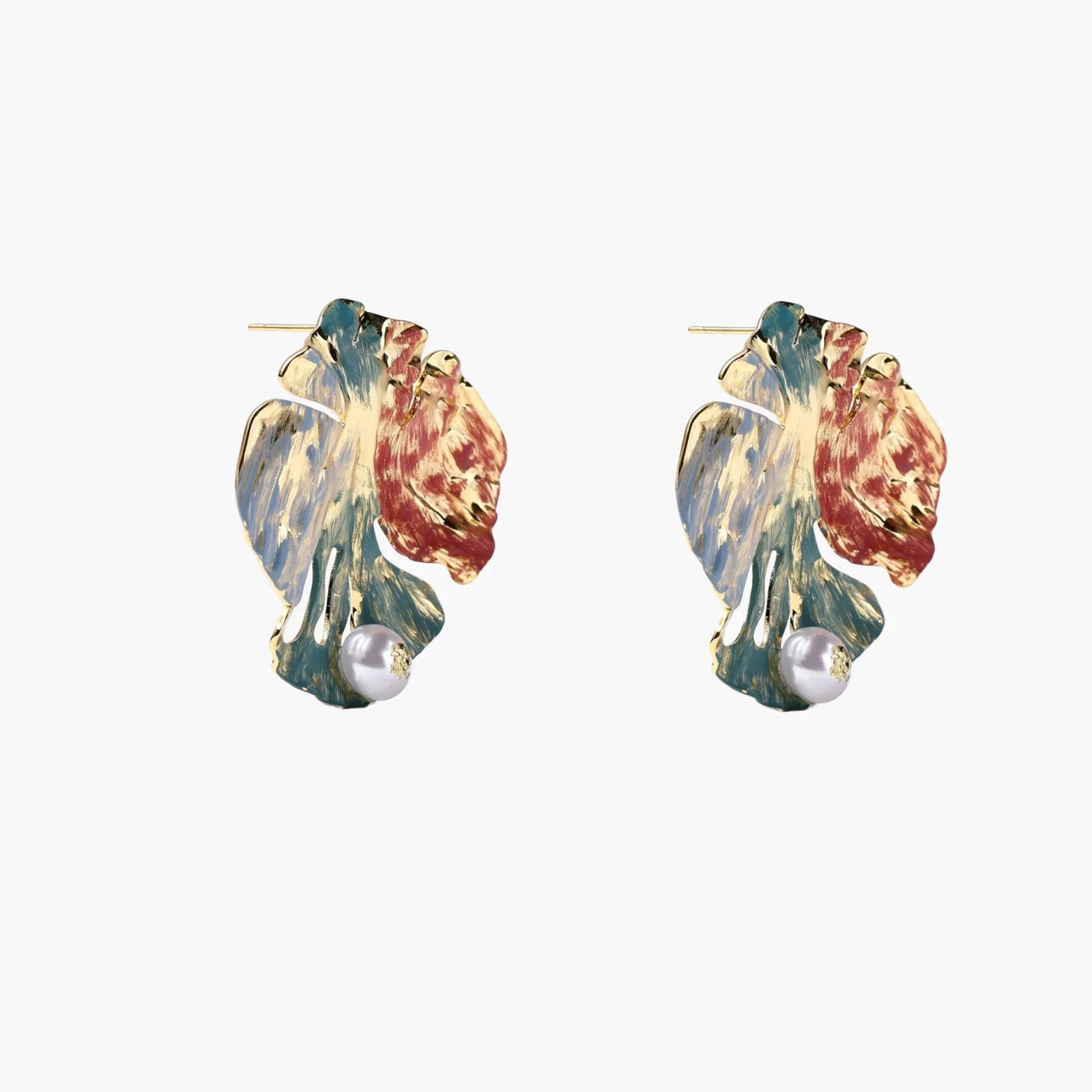 Artistic monstera-shaped earrings with teal, coral, and cream enamel brushstrokes, gold trim, and white pearl accent
