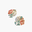 Artistic monstera-shaped earrings with teal, coral, and cream enamel brushstrokes, gold trim, and white pearl accent