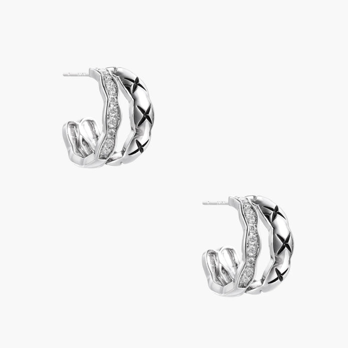 Triple-row white gold hoops with black X-pattern, twisted band, and pavé zirconia stones on white background.