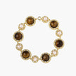 Gold-plated link bracelet with alternating brown tiger's eye stones and white freshwater pearls in ornate bezels.