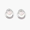White gold-plated brass earrings with circular design, freshwater pearl center, and diamond accents