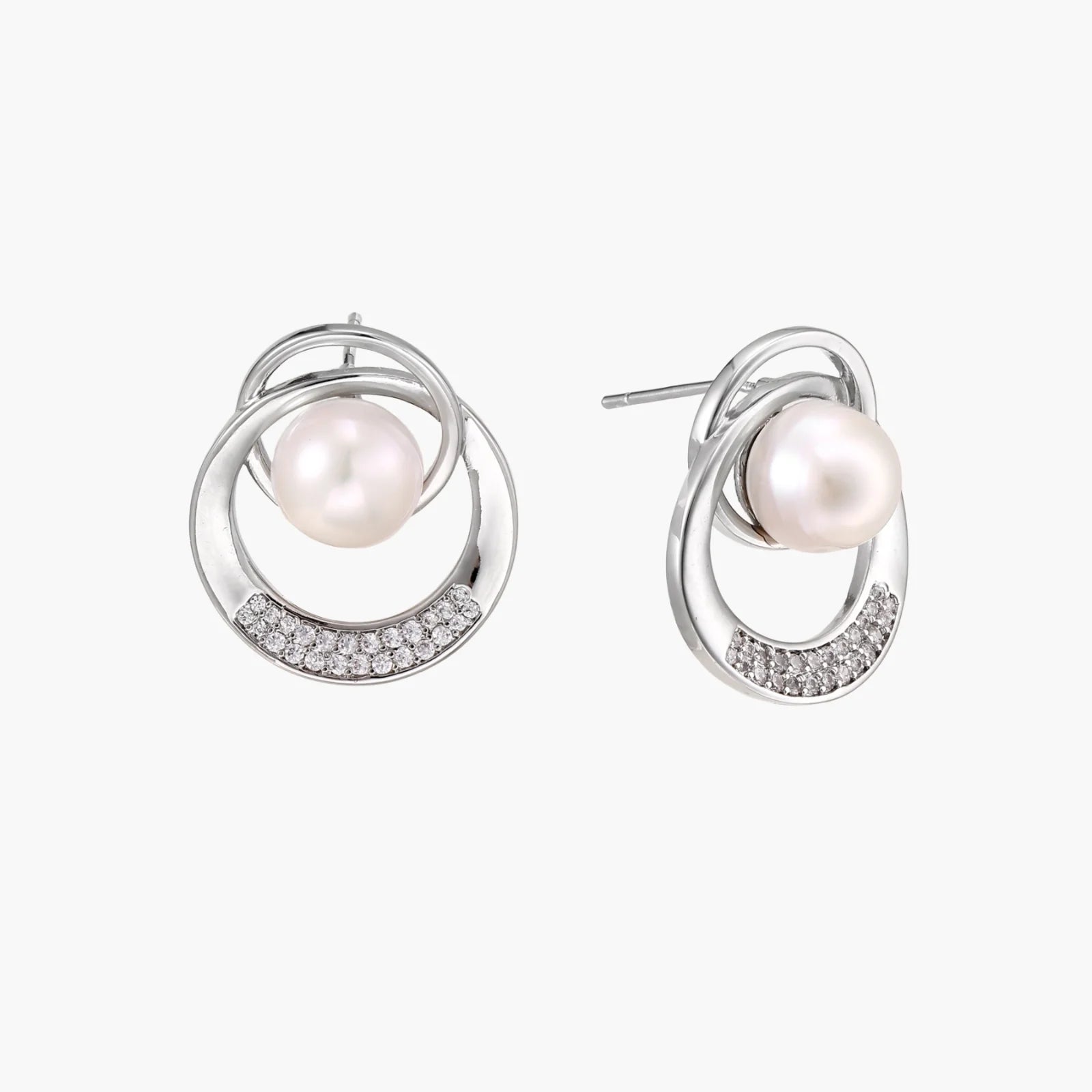 White gold-plated brass earrings with circular design, freshwater pearl center, and diamond accents