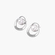 White gold-plated brass earrings with circular design, freshwater pearl center, and diamond accents