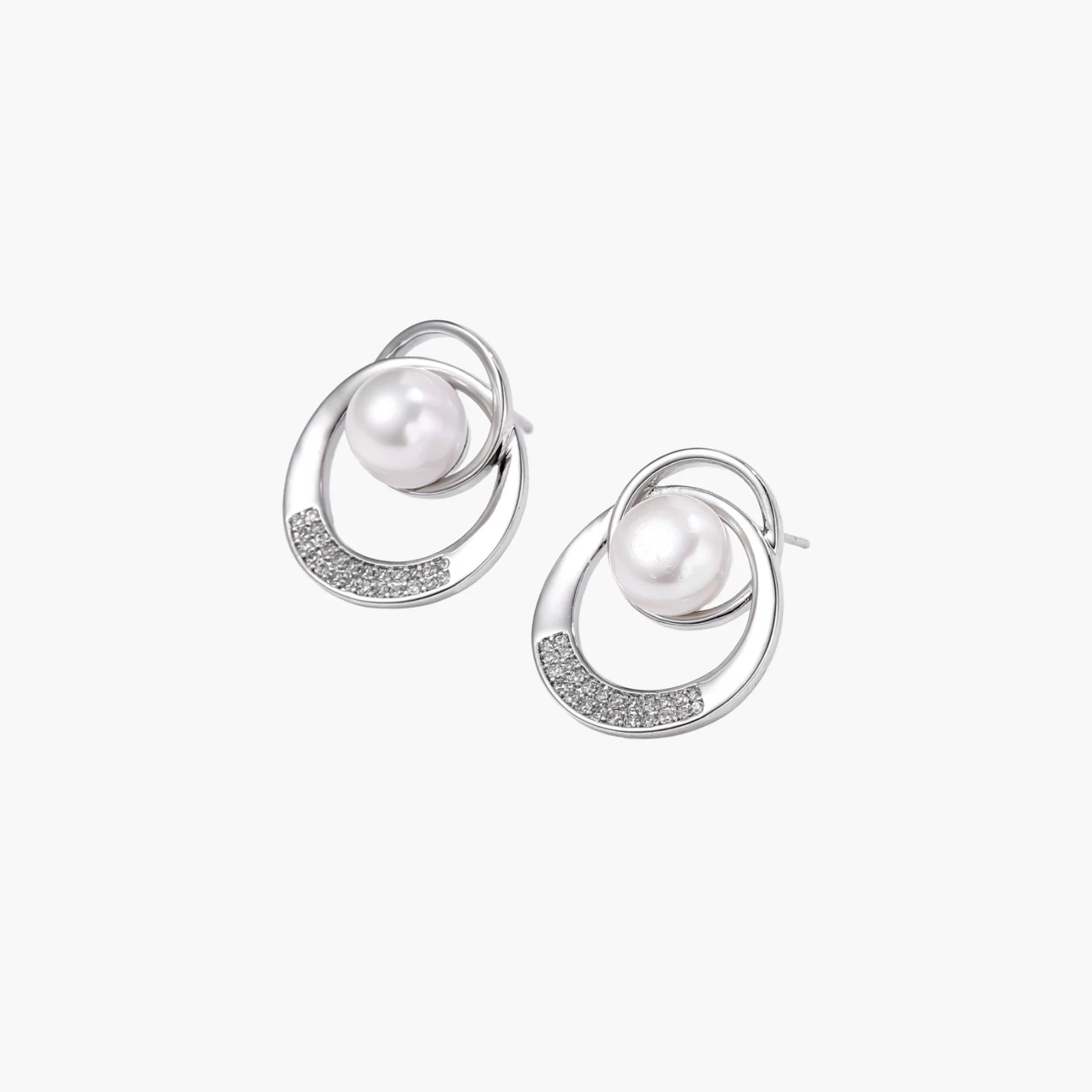 White gold-plated brass earrings with circular design, freshwater pearl center, and diamond accents