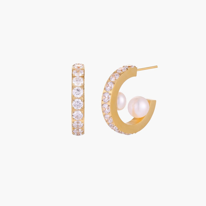 Gold pavé hoop earrings with two freshwater pearls nestled inside the curved design, featuring crystal-studded outer edge.