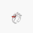 White gold plated spider ring with pearl body, clear zirconia center, and red enamel leg accents on adjustable band