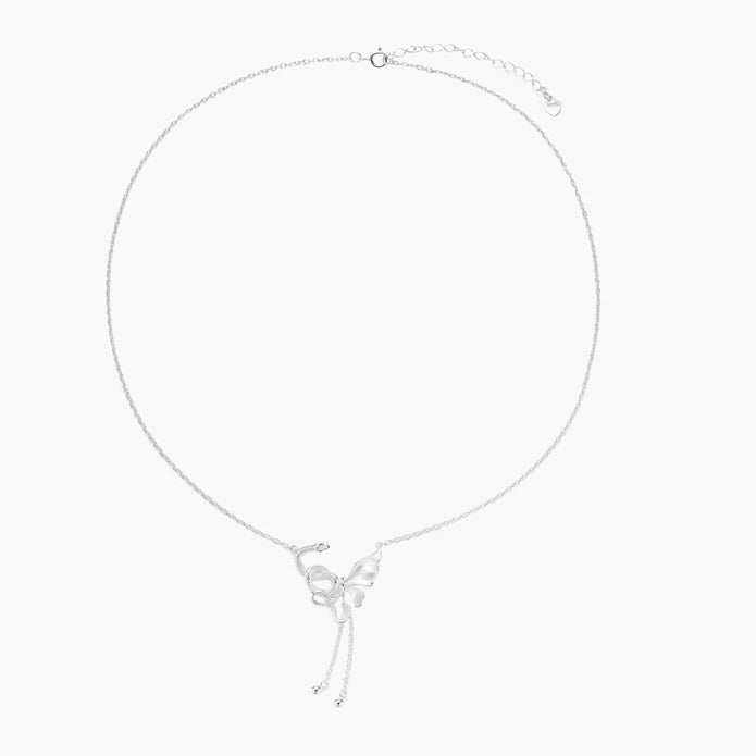 Sterling silver butterfly pendant with textured wing detail on adjustable Y-chain with ball drop ends