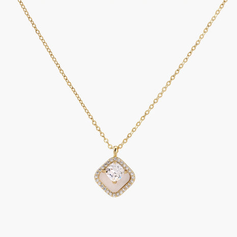 Gold quatrefoil pendant with crystal center on iridescent mother-of-pearl base, adjustable gold chain on cream background