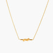 Dainty 18K gold plated necklace with infinity knot pendant on delicate chain against white background