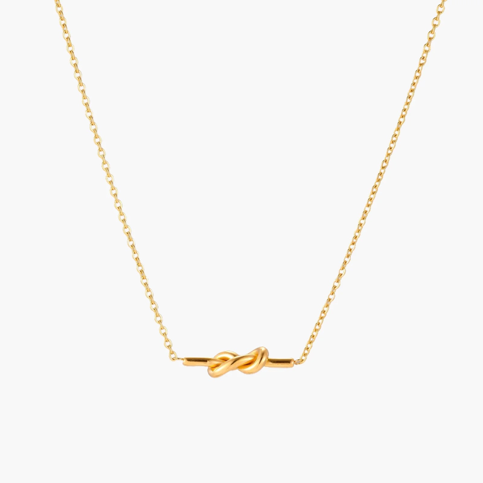 Dainty 18K gold plated necklace with infinity knot pendant on delicate chain against white background