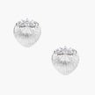 White gold-plated shell-textured stud earrings with three zirconia crystals on ridged surface against cream background.