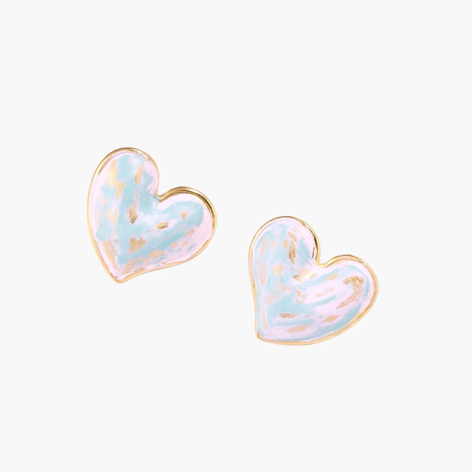 Heart-shaped stud earrings with swirled turquoise and pink enamel in gold-plated frames on cream background
