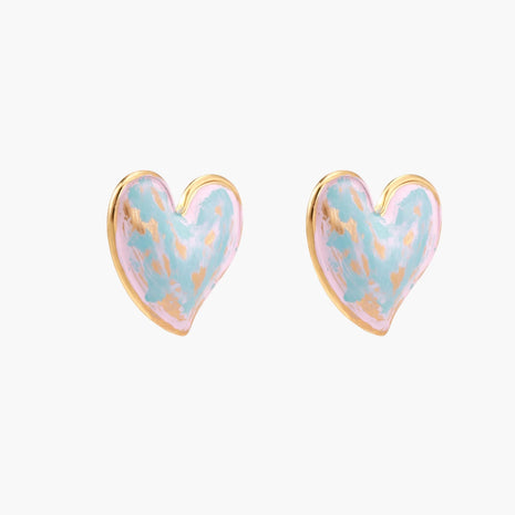 Heart-shaped stud earrings with swirled turquoise and pink enamel in gold-plated frames on cream background