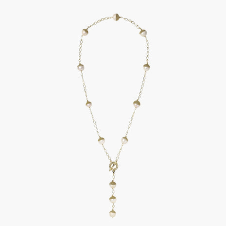Gold-plated lariat necklace with baroque pearls and textured caps on cream background, showing adjustable Y-shaped design.