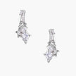 White gold-plated huggie earrings with geometric emerald-cut zirconia clusters in starburst formation on beige background