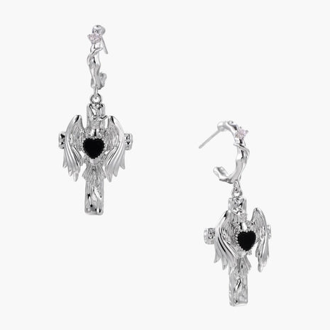 Silver-toned drop earrings with angel wings framing a black heart-shaped stone, white gold plated brass with S925 posts