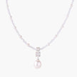 Dainty necklace with lavender crystal beads, freshwater pearls, geometric pendant, and large pearl drop on white background.