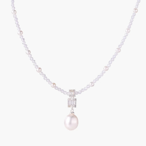 Dainty necklace with lavender crystal beads, freshwater pearls, geometric pendant, and large pearl drop on white background.