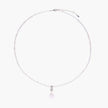 Dainty necklace with lavender crystal beads, freshwater pearls, geometric pendant, and large pearl drop on white background.