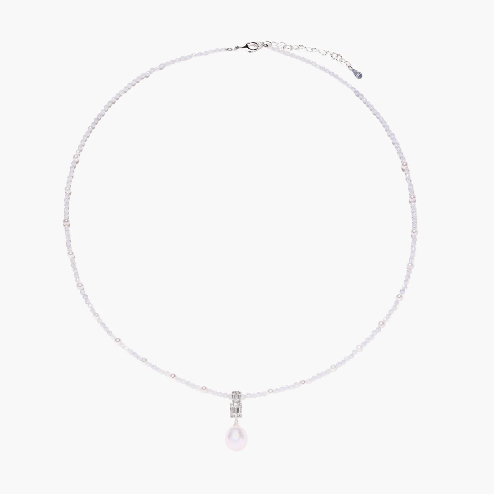 Dainty necklace with lavender crystal beads, freshwater pearls, geometric pendant, and large pearl drop on white background.