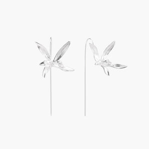 Delicate sterling silver dragonfly earrings with textured wings and curved threader hooks on white background