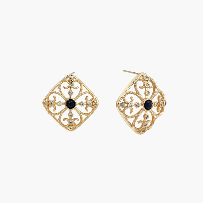 Gold filigree stud earrings with navy lapis lazuli center stone and mother-of-pearl accents in ornate quatrefoil design