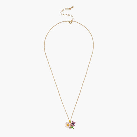 Gold-plated necklace with pink and purple enamel flower pendant featuring crystal accents on cream background