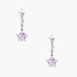 White gold plated huggie earrings with clear CZ accents and dangling lavender star-shaped crystals on cream background