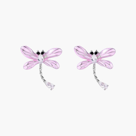 Long drop earrings with translucent lavender enamel dragonfly wings and white gold plated segmented bodies on white background