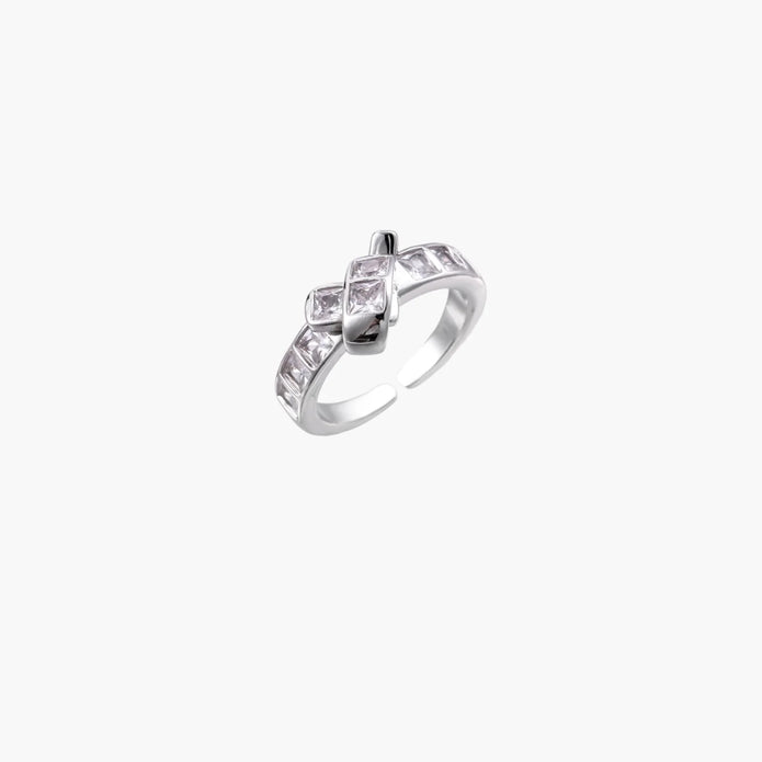 White gold plated adjustable ring featuring offset square cubic zirconia stones in an architectural stacked design